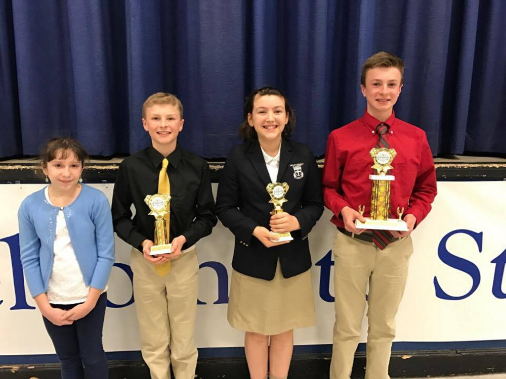 From left are Anna Whitstone, runner-up; Kameron Douin, third-place winner; Carolyn Kinney, second-place winner; and Kyle Douin, first-place winner.