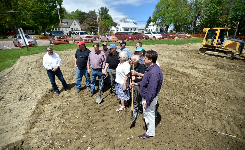 Members of the Oakland town council and gazebo committee break ground at the Messalonskee Lake boat launch for a new gazebo for community use on Friday.