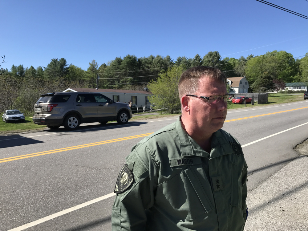 Ken Mason, Kennebec County sheriff, speaks Saturday morning outside the Belgrade home where one person was killed and one was injured in an officer-involved shooting the previous night.