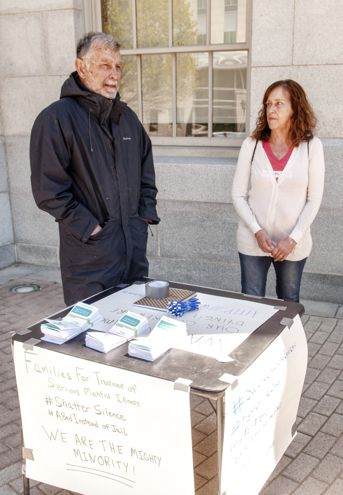 Chip Angell, of Brooklin, left, and Jeanne Gore, of Shapleigh, talk about mental health laws during an interview Saturday at the Maine State House in Augusta.