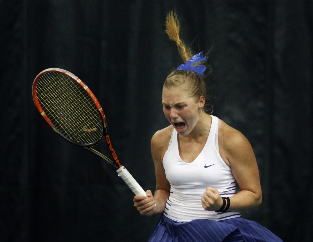 Olivia Leavitt of Falmouth reacts after winning the state singles championship last season. The Rounds of 48 and 32 get under way Friday in Portland.