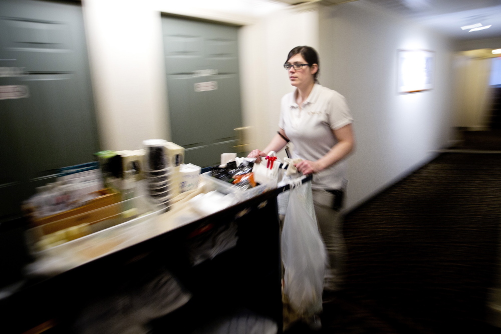 OGUNQUIT, ME - MARCH 17: Tirsha Lizotte, a room attendant at the Meadowmere Resort in Ogunquit, wheels her cleaning cart down a second floor hallway Tuesday, March 17, 2015. Establishments like the Meadowmere hire many foreign workers in positions like Trisha's over the course of the summer on what are called H2B visas but there is currently a hold up on the issuance of these, causing a potential shortage in workforce for inns and hotels. (Photo by Gabe Souza/Staff Photographer)