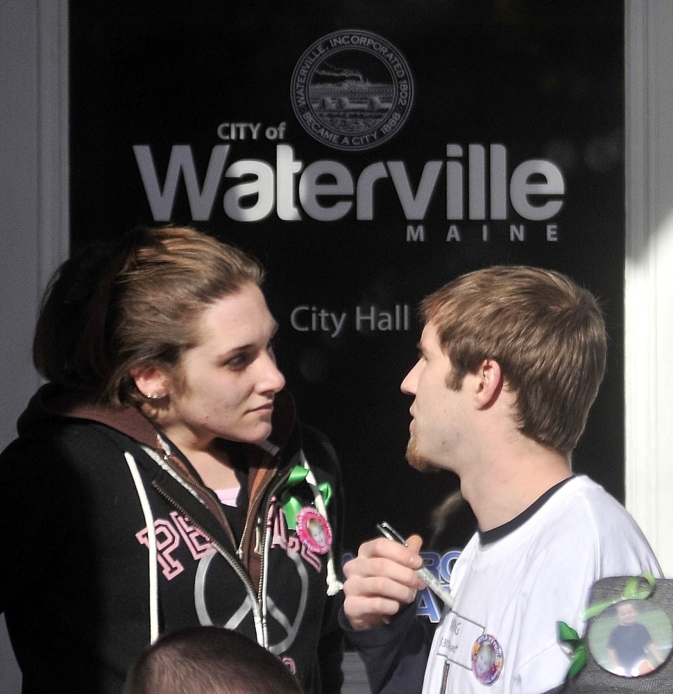 Trista Reynolds, left, and Justin DePietro, right, speak in 2012 on the steps of City Hall during a vigil in Castonguay Square in Waterville for their missing toddler, Ayla Reynolds.