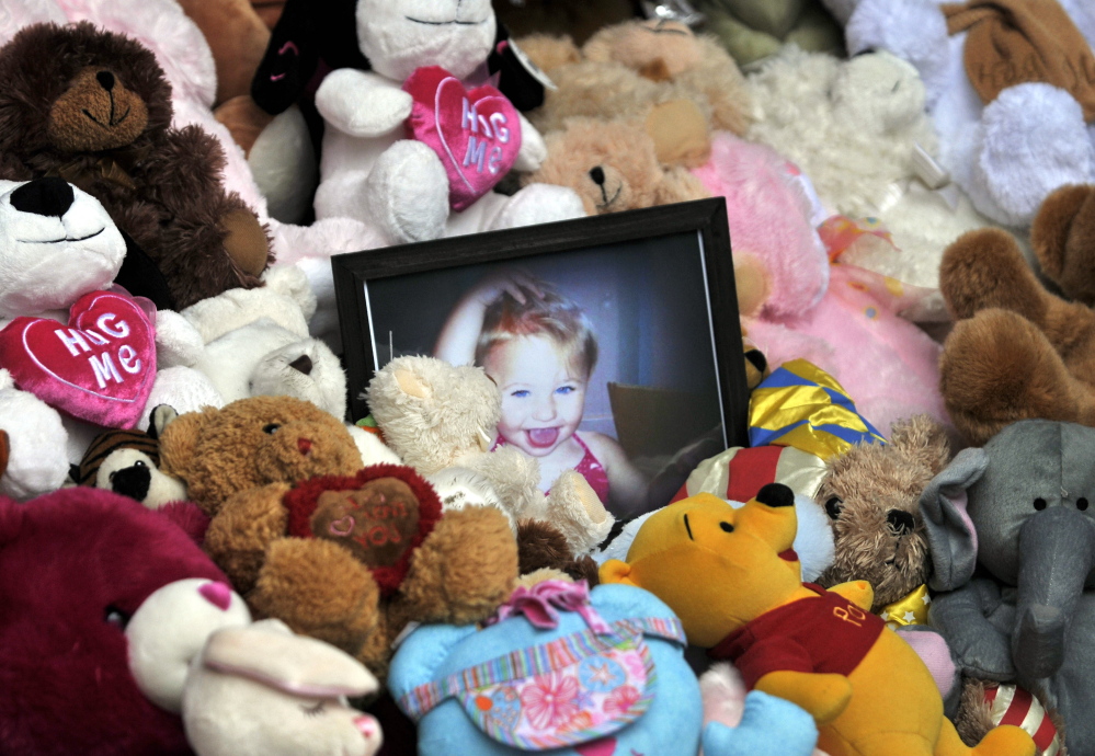 A picture of Ayla Reynolds sits among a shrine of teddy bears in 2012 on the steps of the Waterville City Hall during a vigil for the missing toddler at Castonguay Square in downtown Waterville.