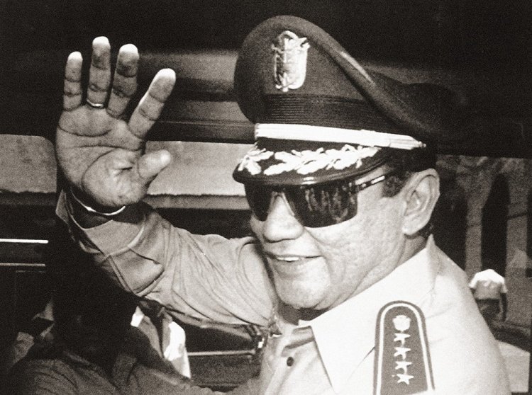 Gen. Manuel Antonio Noriega waves after a meeting at the presidential palace in Panama City on Aug. 31, 1989, when the state council named him president after he nullified the election. 