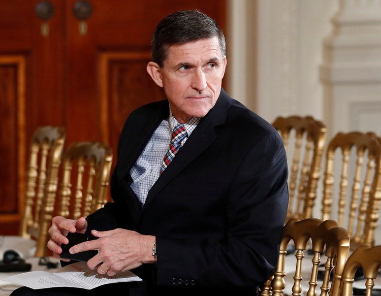 Then-National Security Adviser Michael Flynn sits in the East Room of the White House on  Feb. 10, 2017.  President Barack Obama warned Donald Trump against hiring Michael Flynn as national security adviser during an Oval Office meeting in the days after the 2016 election, according to three former Obama administration officials. 