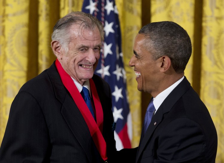 Frank Deford is awarded the National Humanities Medal by President Obama during a ceremony at the White House in 2013.