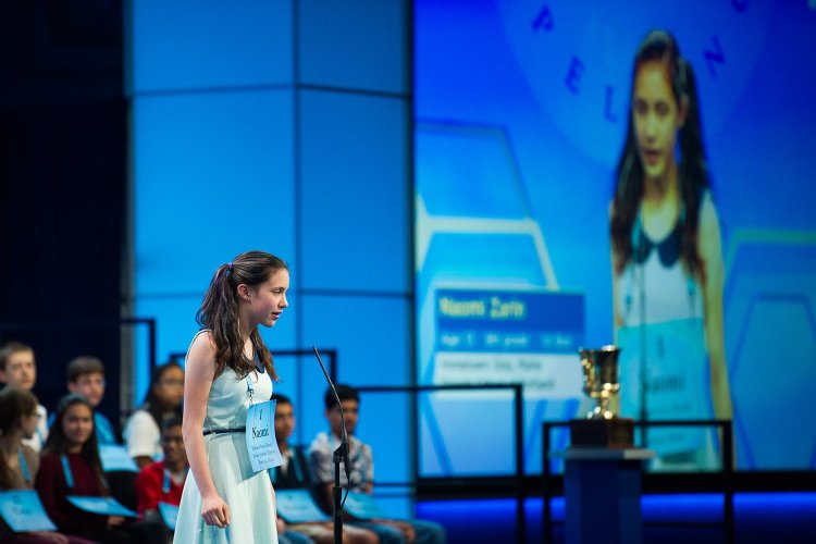 Naomi Zarin, 12, of Gray, Maine, correctly spells her word during the 90th Scripps National Spelling Bee in Oxon Hill, Maryland, on Wednesday.