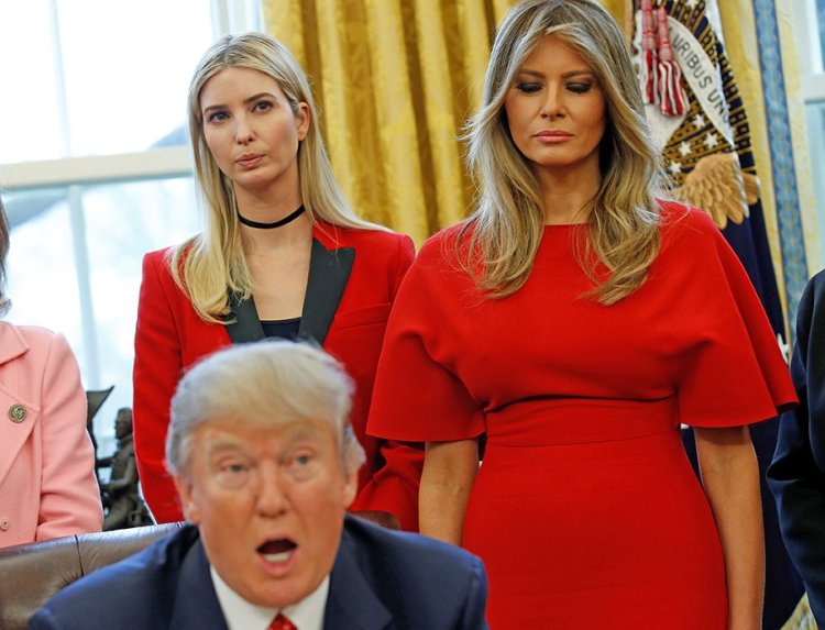 Melania and Ivanka Trump listen as the president peaks before signing H.R. 321 – a bill directing NASA to encourage women and girls to study science, technology, engineering, and mathematics, pursue careers in aerospace, and advance the nation's space science and exploration efforts – in the Oval Office on Feb. 28, 2017.