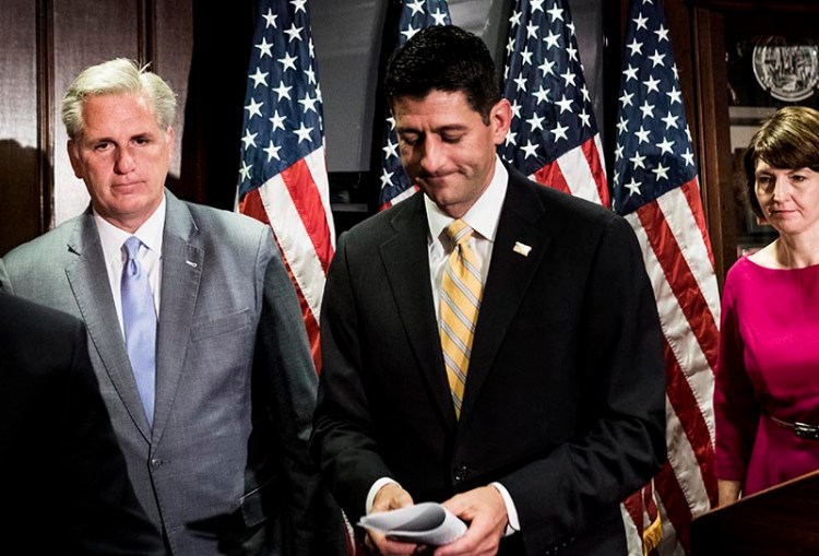 Speaker of the House Paul Ryan, center, and House Majority Leader Kevin McCarthy, left, talk to the press on Wednesday, May 17. 