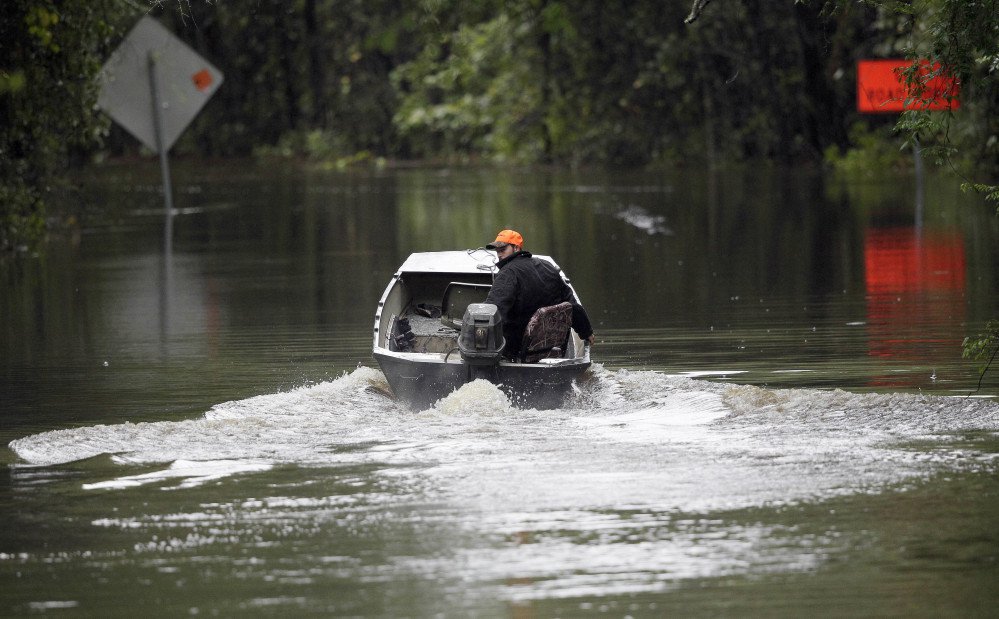A South Carolina man uses his boat on a flooded East Black Creek Road to his home following heavy rains in Florence, S.C. Meteorologists are now as good with their five-day forecasts as they were with their three-day forecasts in 2005, according to ForecastWatch, a private firm that rates accuracy of weather forecasts.