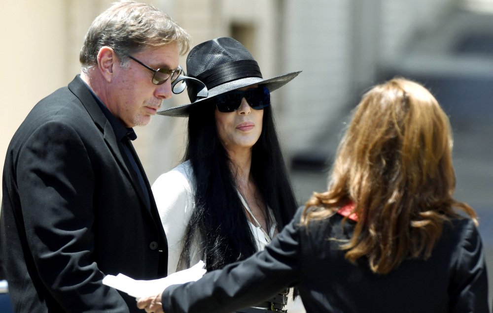 Cher, center, arrives Saturday at Snow's Memorial Chapel for the funeral of music legend and long-ago husband Gregg Allman.