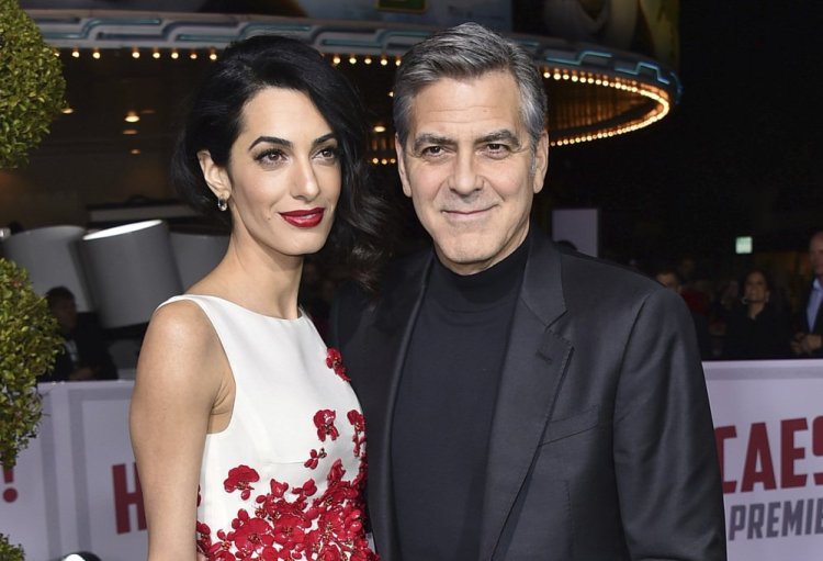 Amal and George Clooney, shown in February 2016, have become the parents of twins Ella and Alexander Clooney.