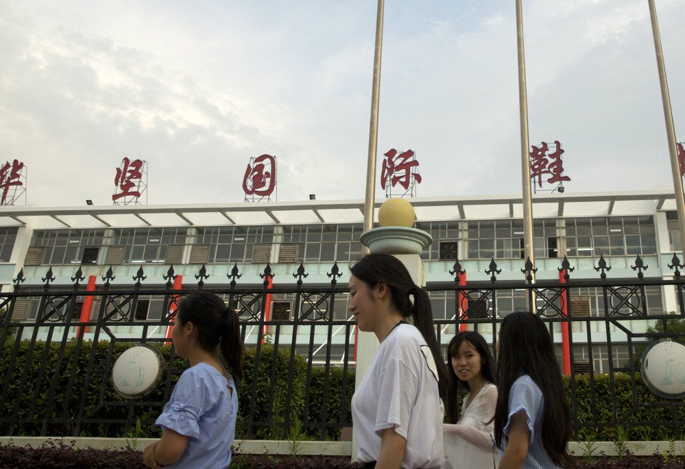 Three Chinese activists were detained in May while investigating labor conditions at Huajian Group, above, the one-time shoemaker for the brand of Ivanka Trump, above right.