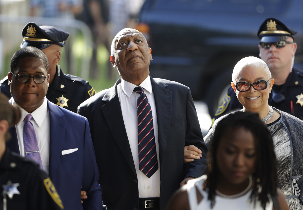 Bill Cosby arrives for his sexual assault trial Monday with his wife, Camille Cosby, right, at the Montgomery County Courthouse in Norristown, Pa. Cosby did not testify, as the defense case took just minutes.