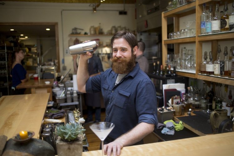 Timm Bielec, the bar manager at Vinland, makes a Pine Gimlet on Saturday.