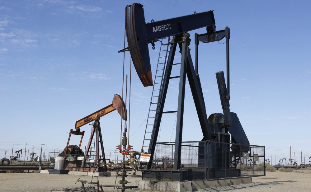 An oil field pump jack operates near Lost Hills, Calif. While Russia, Saudi Arabia and others have met targeted cuts, an unforeseen increase in U.S. supply has countered their efforts. Thus, consumers can expect cheaper energy and car fuel.