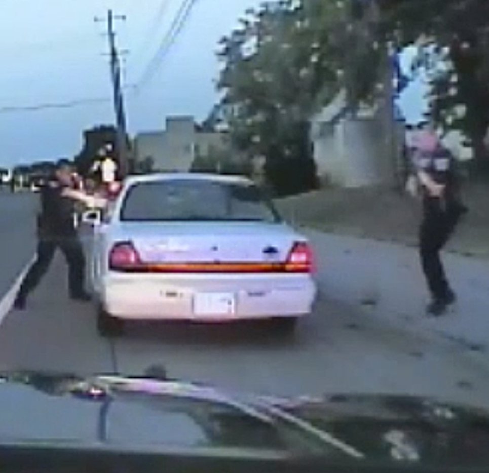 In this image made from St. Anthony Police officer Jeronimo Yanez's dashcam shows him shooting Philando Castile.
