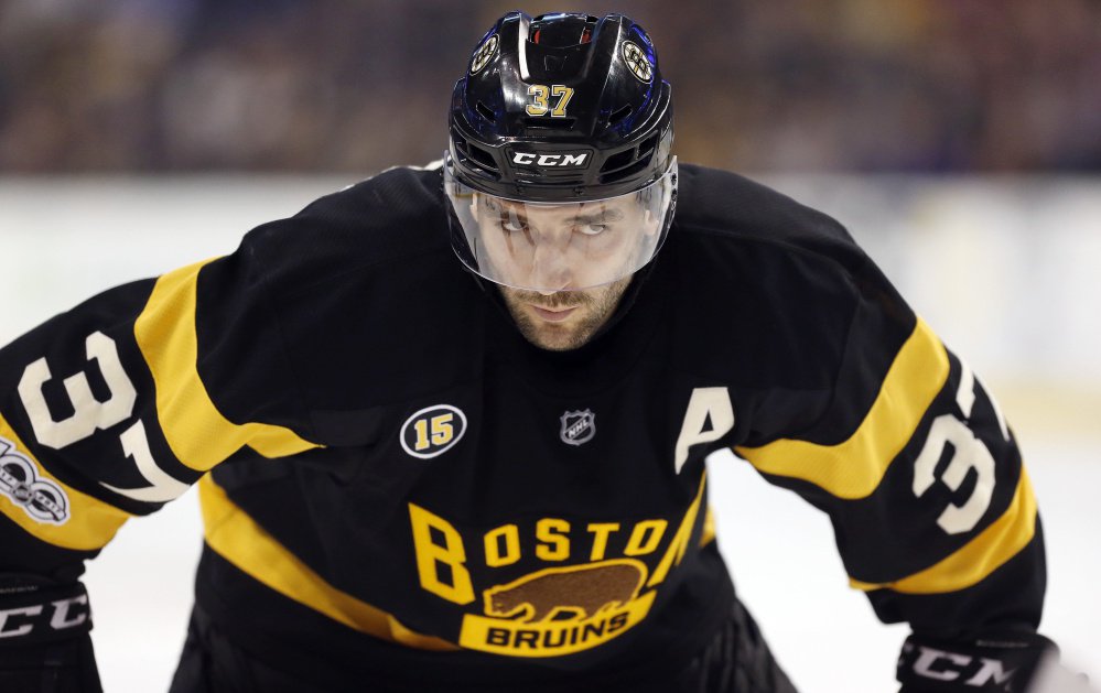 Boston's Patrice Bergeron waits for a faceoff during a March 4 game against the Devils. Winning faceoffs was just one of Bergeron's defensive contributions – and something he did more than any other player last season.