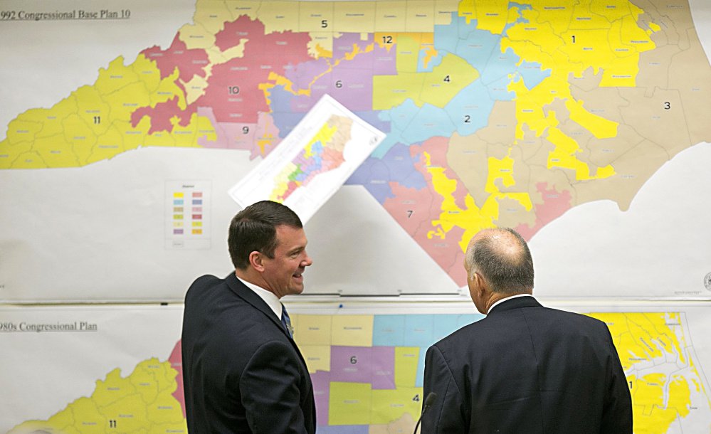 North Carolina Republican state Sens. Dan Soucek, left, and Brent Jackson review historical maps during The Senate Redistricting Committee for the 2016 Extra Session in the Legislative Office Building in Raleigh, N.C., last year.