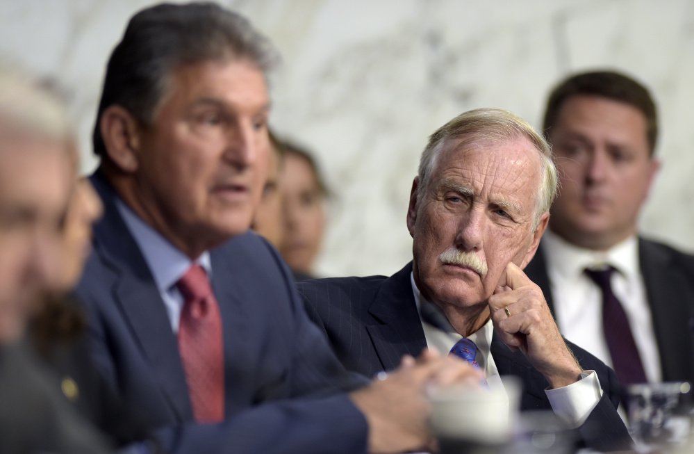 Sen. Angus King, an independent from Maine who caucuses with Democrats, listens as Sen. Joe Manchin, D-W.Va., asks a question during a Senate Intelligence Committee hearing about the Foreign Intelligence Surveillance Act on Capitol Hill in Washington on June 7. King says meddling by Russia in the 2016 U.S. election isn't getting enough scrutiny.