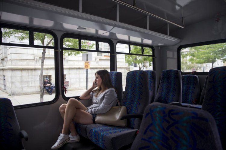 Sarah Perkins rides the Metro Breez bus from Freeport to Portland on Monday.