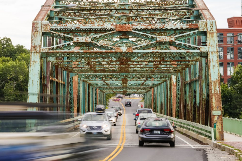 The Frank Woods Bridge between Brunswick and Topsham, showing its age in August 2016, should be replaced rather than renovated, says the Maine Department of Transportation.