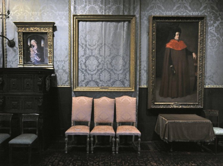 The empty frame, center, from which thieves cut Rembrandt's "Storm on the Sea of Galilee" remains on display at the Isabella Stewart Gardner Museum in Boston.