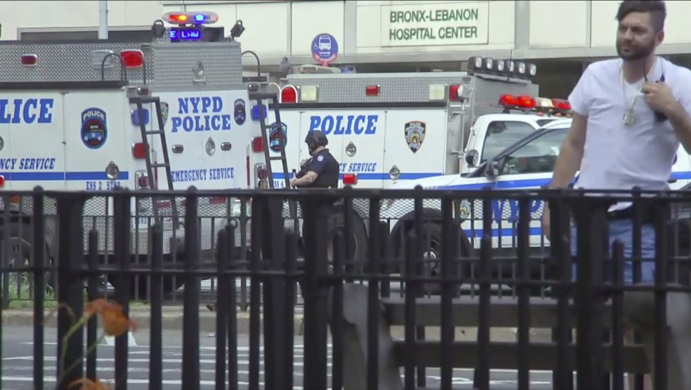 In this image taken from video, emergency personnel converge on Bronx Lebanon Hospital in New York, after a gunman opened fire there on Friday.
