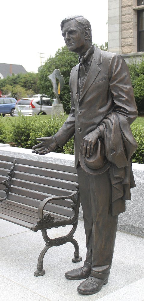 A sculpture of former New Hampshire Gov. John Winant invites passers-by to join him on a bench in Concord, N.H.