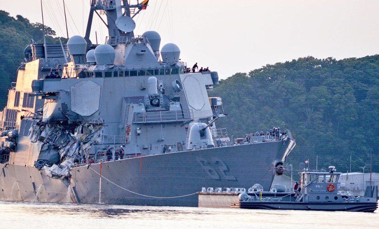 The USS Fitzgerald (DDG 62) returns to base following the collision with a cargo ship while operating southwest of Yokosuka, Japan.