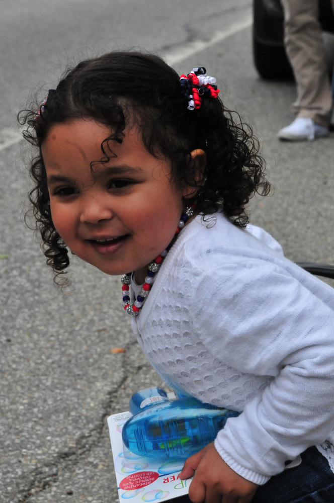 Sophia Carlson, 3, of Gardiner, watched the Gardiner Memorial Day Parade Monday.