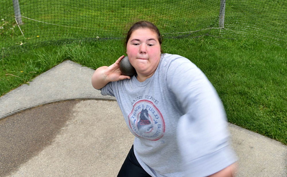Waterville thrower Sarah Cox prepares to heave the shot put during practice Wednesday.