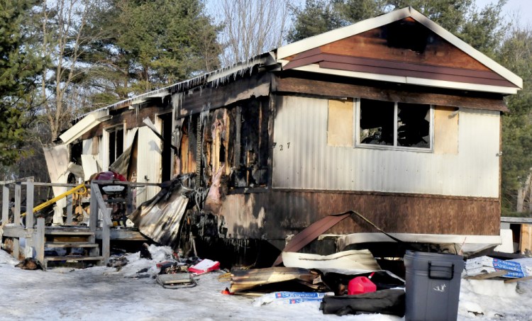 A fire ripped through this mobile home on Feb. 4, 2017, on Browns Corner Road in Canaan. A fundraiser is being held Sunday in Winslow to benefit Laura Dudley, who escaped from the home with her two dogs, but her cat perished in the blaze.