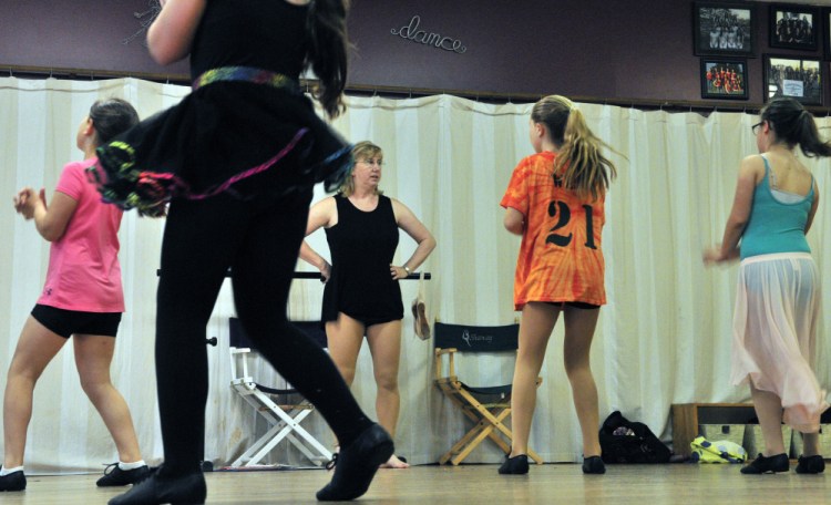 Vicki Gilbert watches dancers in a third-and-fourth-grade jazz dance class Thursday at Vicki's School of Dance in Hallowell. She has been running the business for 40 years.