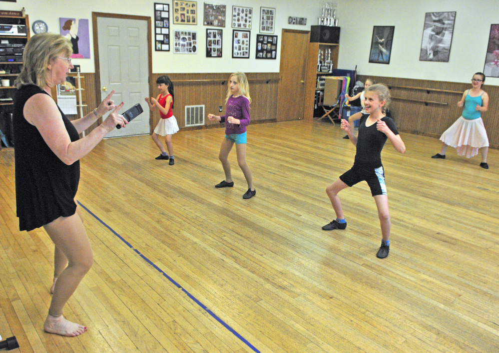 Vicki Gilbert cues dancers in a third-and-fourth-grade jazz dance class as they rehearse for her studio's 40th annual recital Thursday at Vicki's School of Dance in Hallowell. She has been running the business for 40 years.