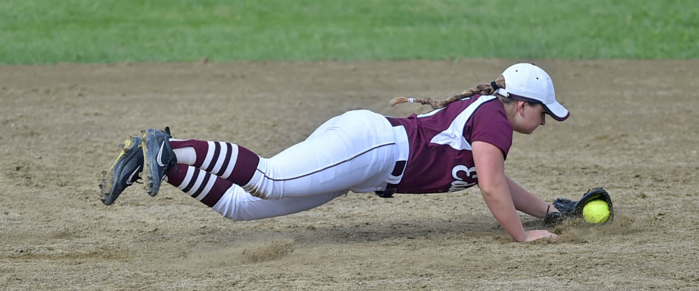 Edward Little's Taylor Depot makes a diving stop on a grounder against Skowhegan during the Kennebec Valley Athletic Conference Class A title game Friday.
