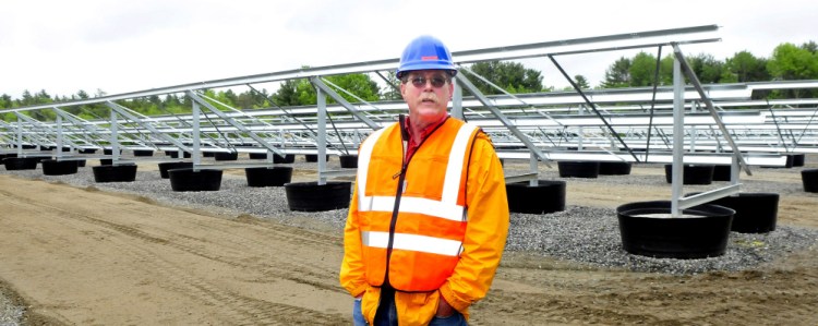 Gus Libby, assistant director of Operations at Colby College, expects the new solar facility under construction near the Waterville campus on Monday will be producing energy sometime this fall if the weather cooperates.