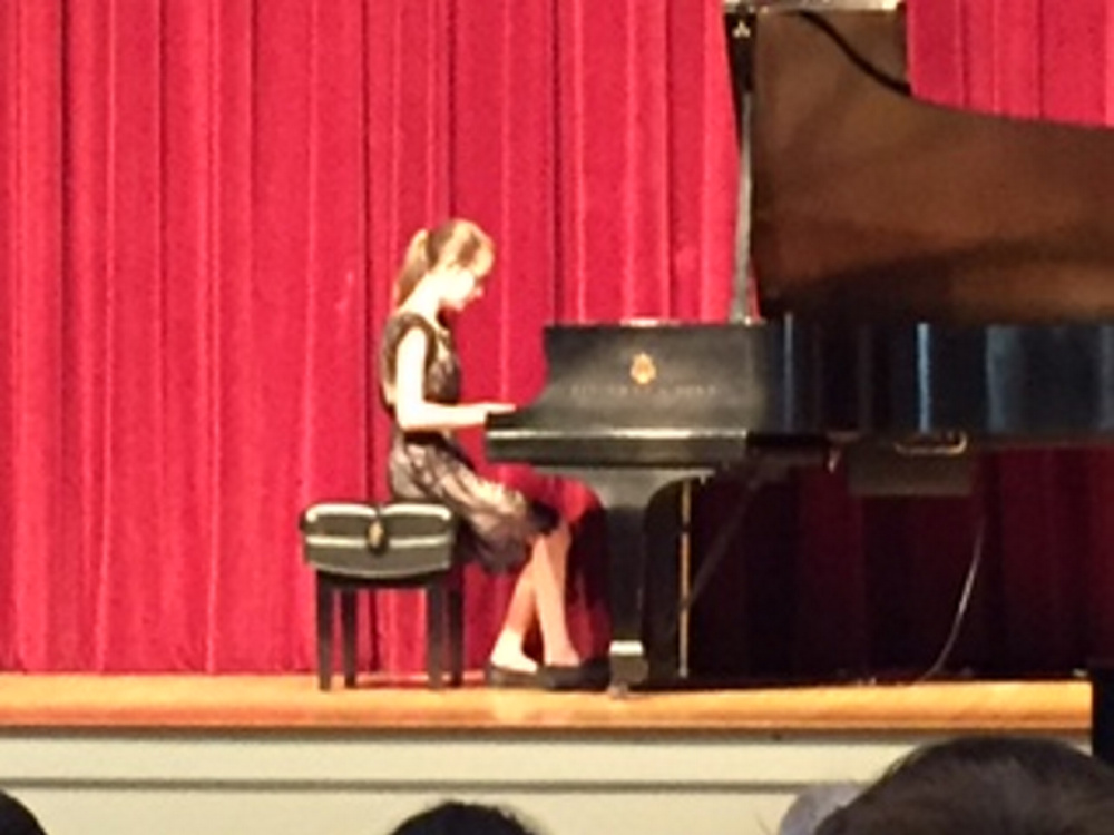 Karin Zimba, a sixth grader at Waterville Junior High School, at the piano during the May 6 Pine Tree Piano Festival. She won first place in the Late ELementary Division.