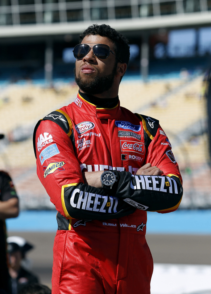 In this March 12, 2016, file photo, Darrell Wallace Jr. looks on from pit road during NASCAR Xfinity Series qualifying at Phoenix International Raceway in Avondale, Arizona.