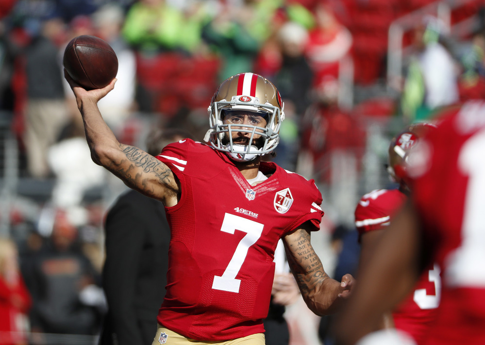 In this Jan. 1 photo, 49ers quarterback Colin Kaepernick warms up before a game against the Seahawks in Santa Clara, California