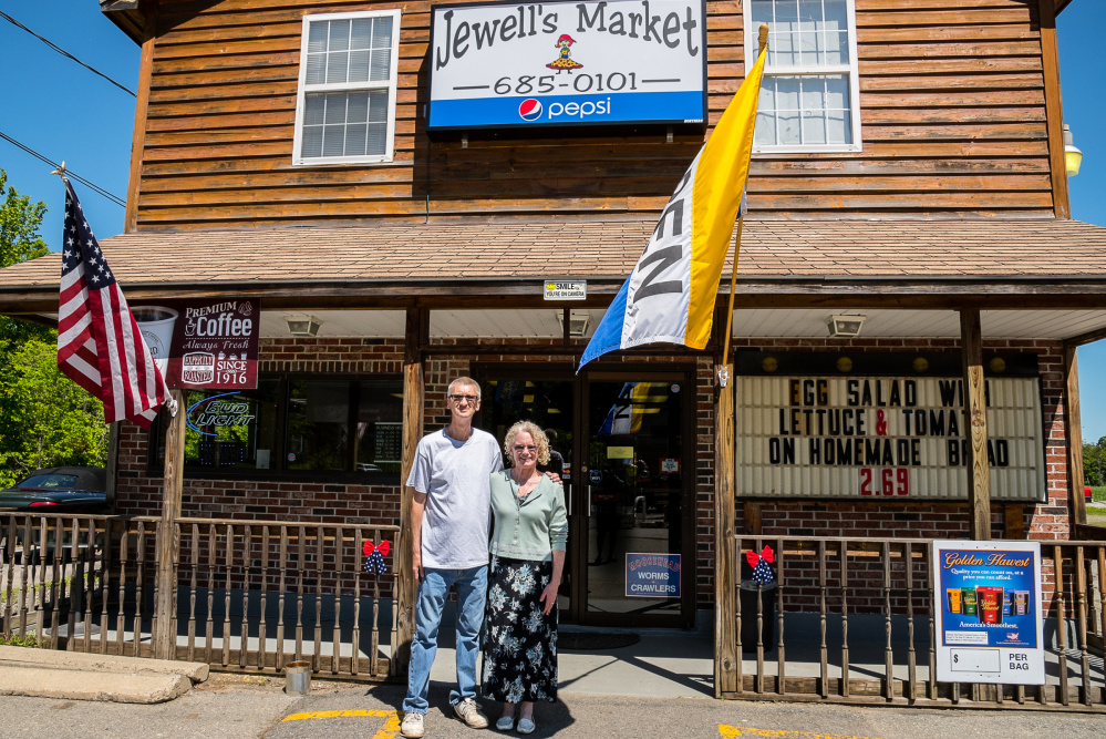 Fred and Sherri Jewell, the new owners of Jewell's Market on Main Street in Readfield, stand in front of their newly opened store on Wednesday.