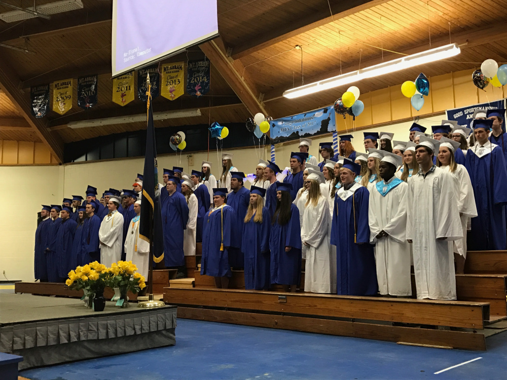 Mt. Abram's graduating class of 2017 stands during commencement on Friday night at Mt. Abram High School in Strong.