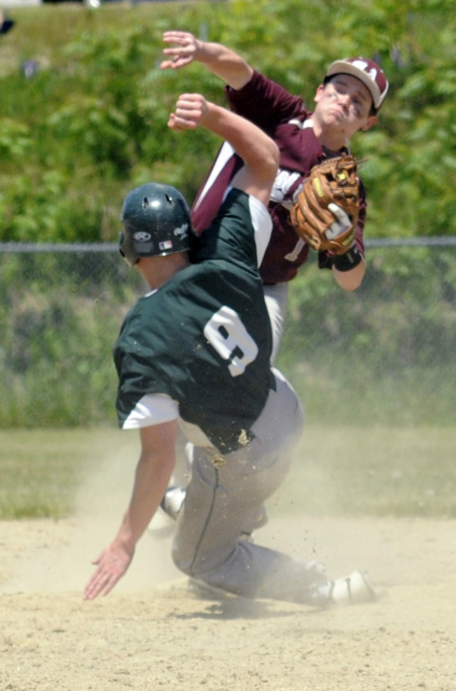 Staff photo by Joe Phelan 
 Monmouth second baseman Matt Foulk throws to first as Winthrop baserunner Matt Ingram slides into him during a game-ending double play in a Class C South semifinal Saturday afternoon in Winthrop.