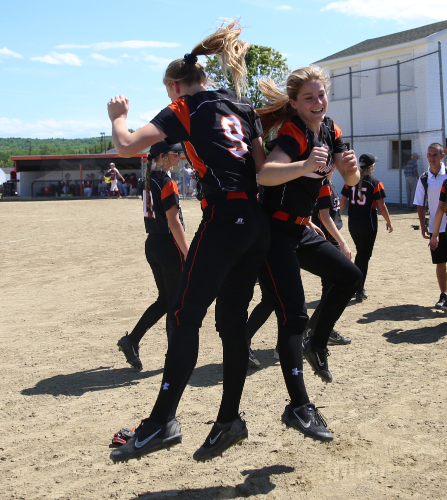 Members of the Skowhegan softball team celebrate after they defeated Bangor 12-0 in a Class A North semifinal Saturday in Skowhegan.