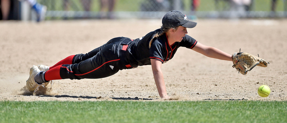 Lisbon's Brittany Norman dives for a grounder off the bat of Madison hitter Madeline Wood during a Class C South semifinal Saturday afternoon in Madison.