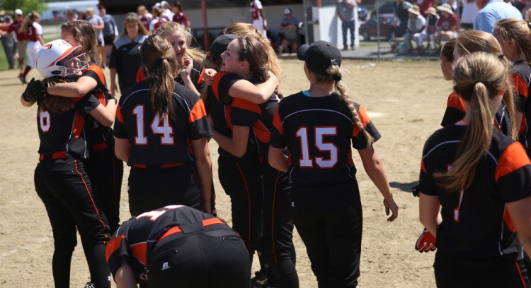 The Skowhegan softball team celebrates its victory over Bangor in a Class A North semifinal game Saturday.