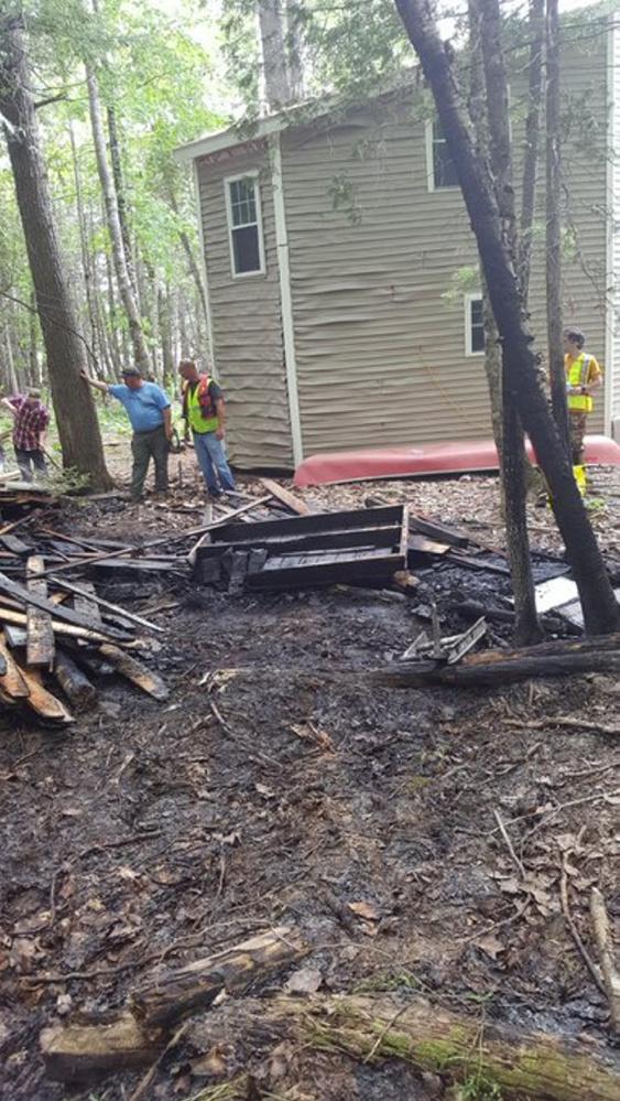State forest rangers and firefighters from several departments, including Canaan's, responded to a fire on Sibley Pond where two buildings were damaged.