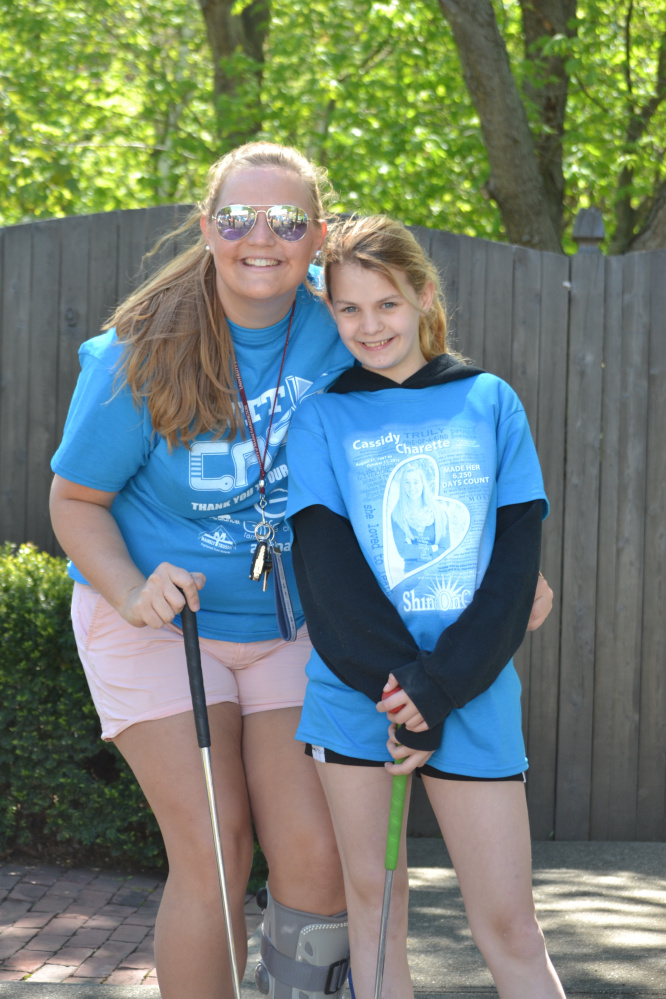 "Big Sister" Anna Dobos and her "Little Sister" Delaney Bickford were among the 250 people who attended Big Brothers Big Sisters of Mid-Maine's first "Putt 4 Cass" event May 20 at Gifford's Famous Ice Cream and Mini Golf in Waterville. The event, held in memory and honor of Cassidy Charette, raised more than $25,000 to support local BBBS school-based mentoring programs.