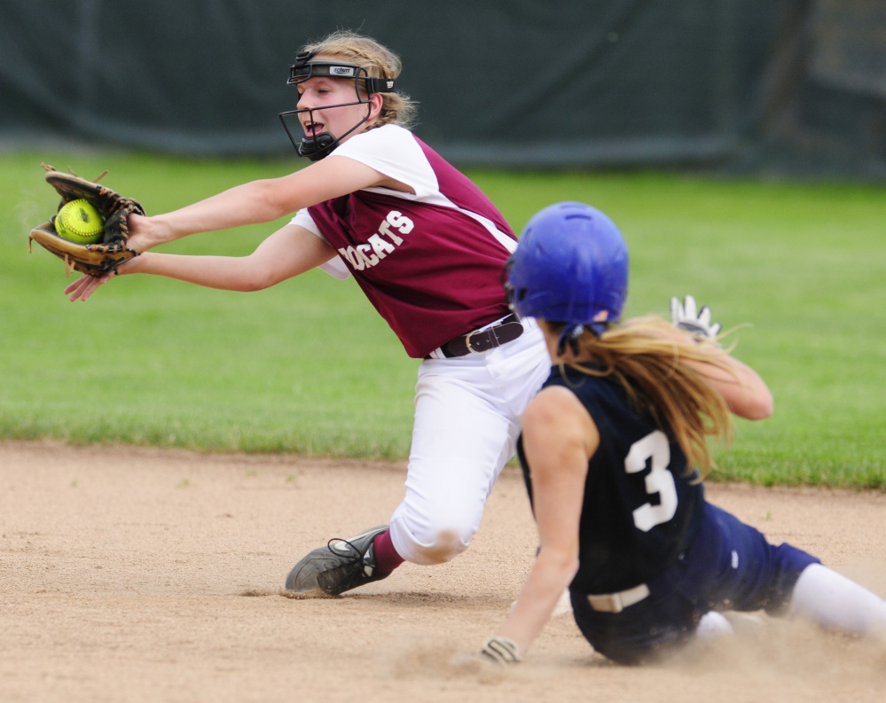 Greenville's Jessica Pomerleau slides safely into second base as Richmond shortstop Caitlin Kendrick catches the ball during the Class D South regional final Tuesday at St. Joseph's College in Standish.